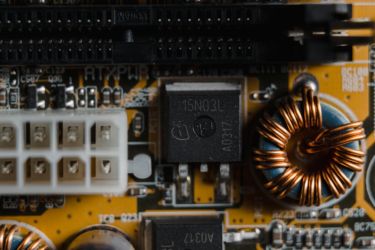 About Detailed close-up of electronic components on a circuit board, showcasing intricate engineering.